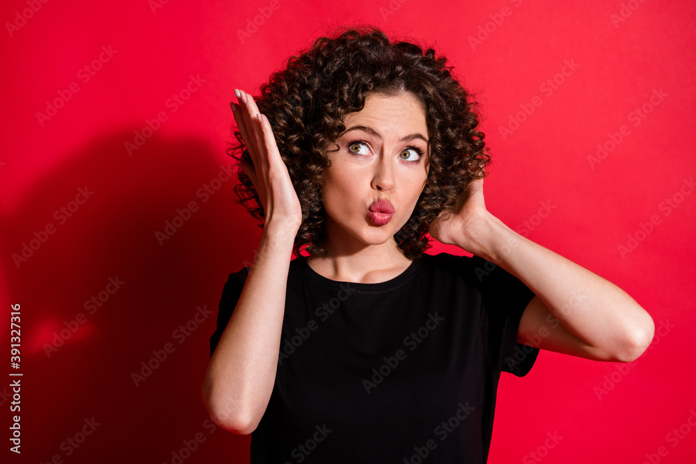 Close-up portrait of lovely glamorous flirty wavy-haired girl touching haircut pout lips isolated over bright red color background Close-up portrait of lovely glamorous flirty wavy-haired girl touching haircut pout lips isolated over bright red color background