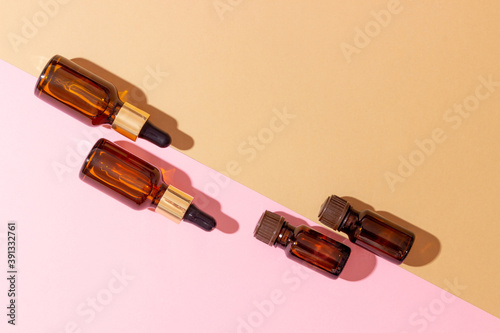 A set of amber bottles for essential oils and cosmetics. Glass bottle. Dropper  spray bottle