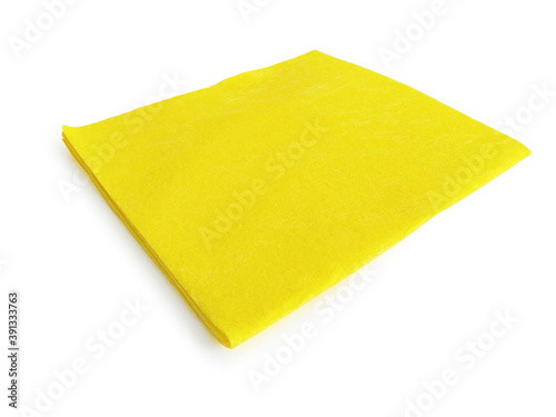 Square soft yellow cloth isolated on white background. Multipurpose anti-bacteria cleaning rag and dust trap. Close up of Disposable and ecological accessory for cleaning all surfaces.