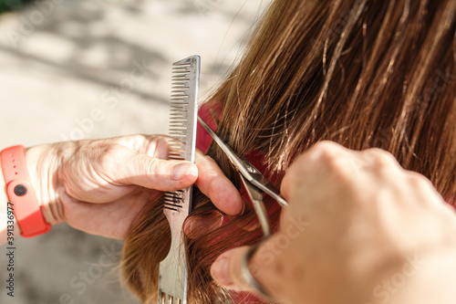 Hair cutting outside the home.