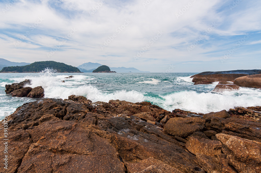 View of the sea with rocks from the natural pools of Trindade, Paraty, RJ.