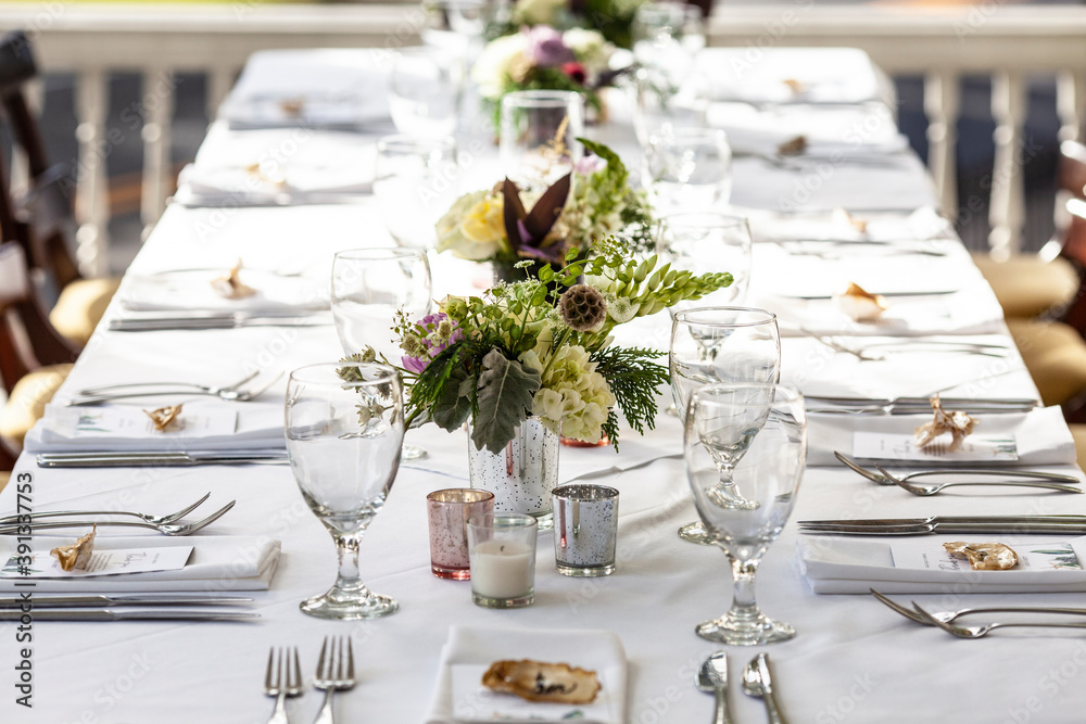 Fototapeta premium Classy table set up for meal at an outdoor wedding reception