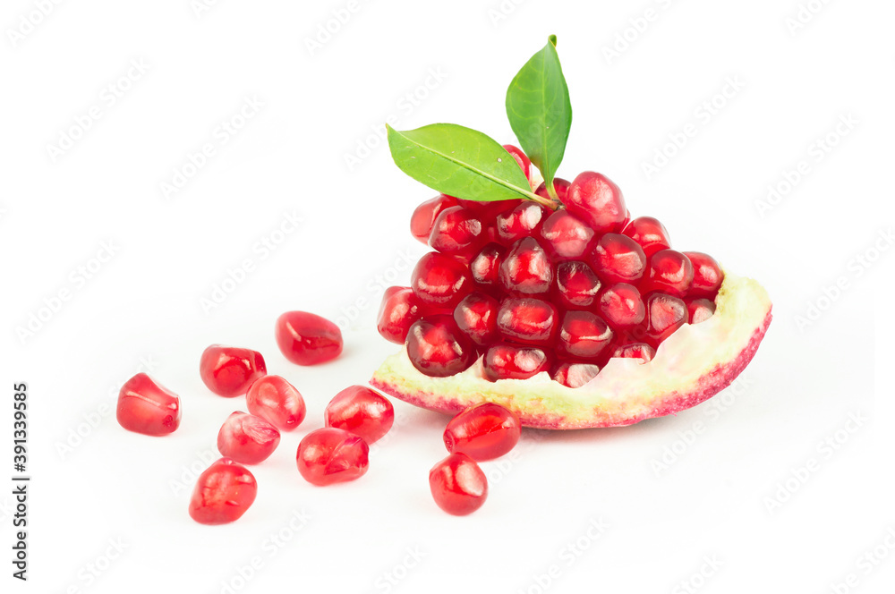 Fresh ripe split juicy pomegranate with seeds and leaves isolated on white background, healthy red fruits concept copy space (Punica granatum) Fresh ripe split juicy pomegranate with seeds and leaves isolated on white background, healthy red fruits concept copy space (Punica granatum)