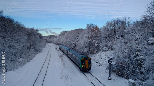 Green Train in snow with Tyseley Incinerator
