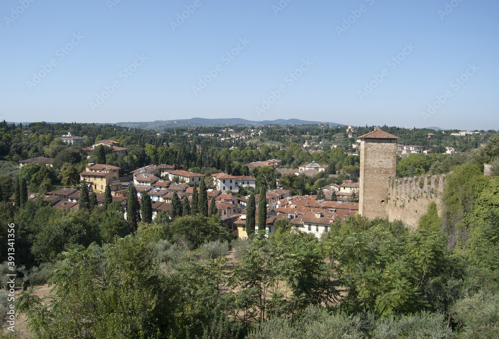 
view of the Tuscan hills with tower and fortification wall