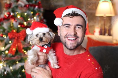 Cute man and his dog during Christmas 