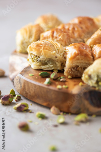 Turkish dessert baklava with pistachios on grey background. Top view. Copy space. Set of assorted traditional eastern desserts. Arabian sweets, turkish delight.