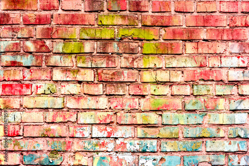 Texture of a brick wall with cracks and scratches which can be used as a background