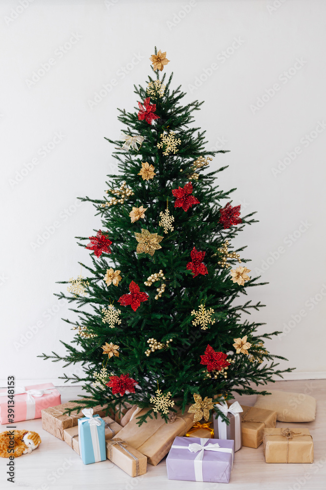 Christmas tree with decorations and gifts interior of the house new holiday white