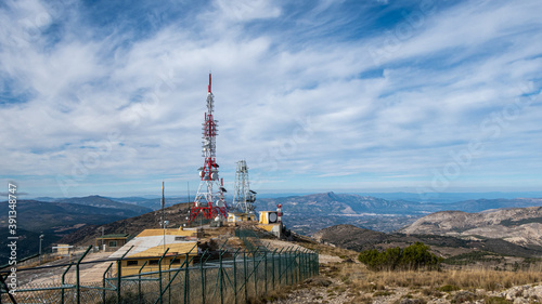 Different tipes of antennas, for communications like Radio, Tv or telephon mobile, in the top of a montain. © MiguelAngel