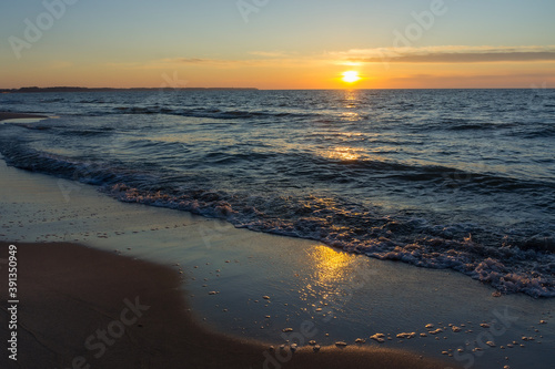Wallpaper Mural Sunset over the sea. Reflection of sunlight in the sea waves. The sky in the sunset. Baltic sea. Torontodigital.ca