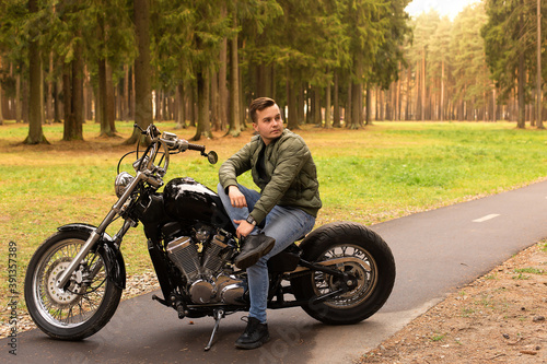 Beautiful young man, road, motorcycle