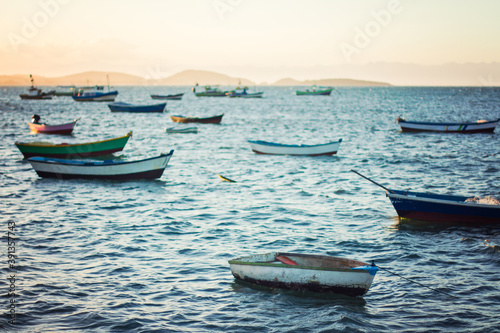 Line up of boats at sunset in Buzios, Brazil photo