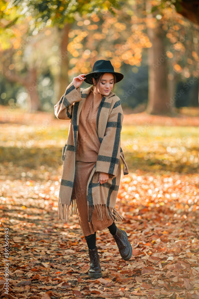 Autumn portrait of a beautiful young woman in the park Autumn portrait of a beautiful young woman in the park