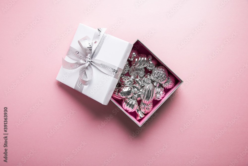 Merry Christmas and Happy Holidays greeting card, frame, banner. New Year. Noel. Christmas white silver ornaments and gift box on pink background top view. Winter xmas holiday theme. Flat lay
Merry Christmas and Happy Holidays greeting card, frame, banner. New Year. Noel. Christmas white silver ornaments and gift box on pink background top view. Winter xmas holiday theme. Flat lay