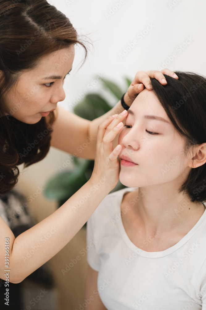 Two Young Friends Applying Makeup At Home Two Young Friends Applying Makeup At Home