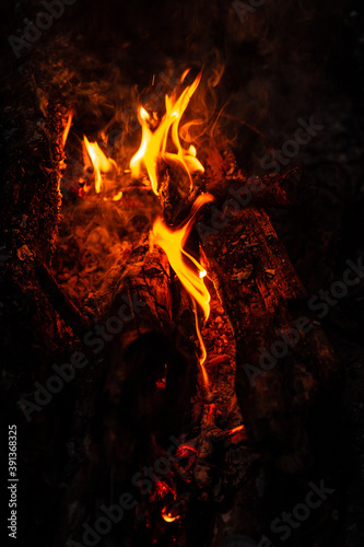 Glowing embers with sparks - firewoods Close-Up
