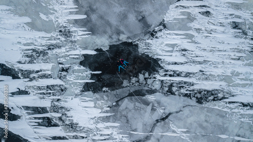 aerial view of a lovely couple in the middle of a frozen river photo