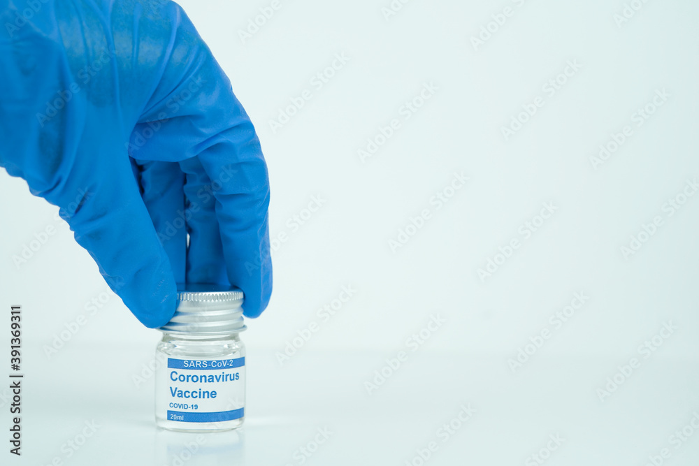 vials with the Covid-19 vaccine on a laboratory bench. to combat the coronavirus sars-cov-2 pandemic vials with the Covid-19 vaccine on a laboratory bench. to combat the coronavirus sars-cov-2 pandemic