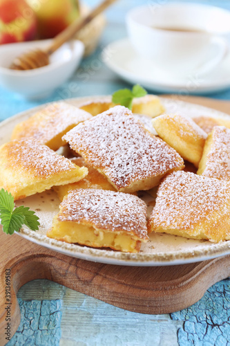 Kaiserschmarrn. Sweet torn pancake (or omelet) with honey and cup of tea