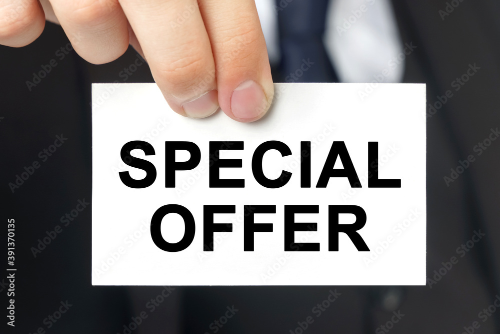 Businessman shows a card with the text SPECIAL OFFER Businessman shows a card with the text SPECIAL OFFER