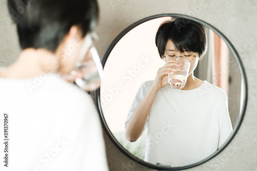 Girl is brushing teeth and gargling photo