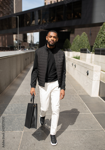 Man in black vest in the city photo