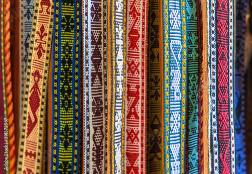 Traditional indigenous fabric belts on a local art and craft market, Santo Tomas Jalieza, Oaxaca state, Mexico.  photo