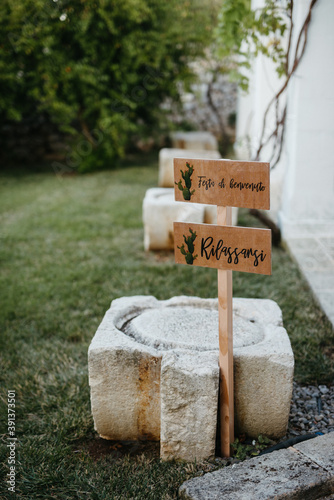 Italian wedding sign with 'Festa di benvenuto' photo