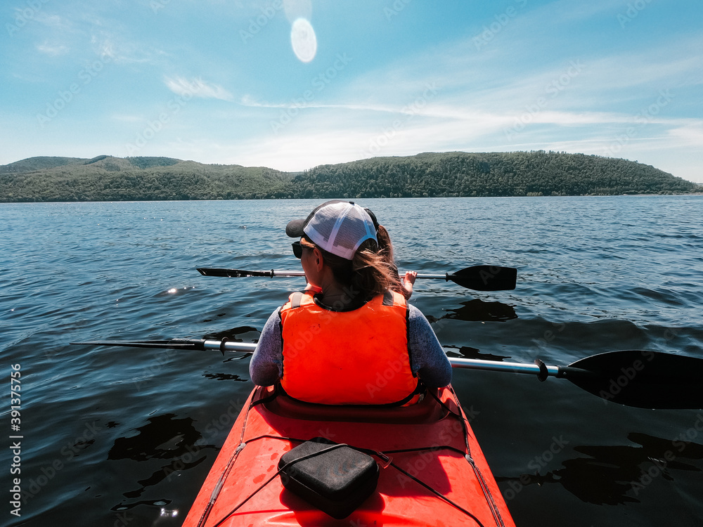 Two sisters go kayaking on a sunny summer day Two sisters go kayaking on a sunny summer day