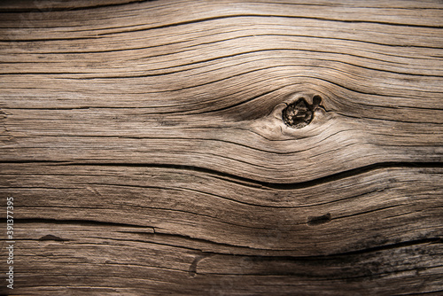 dark brown color backdrop of old retro vintage aged wooden texture background with crack and snag Dramatic dusk luxury light