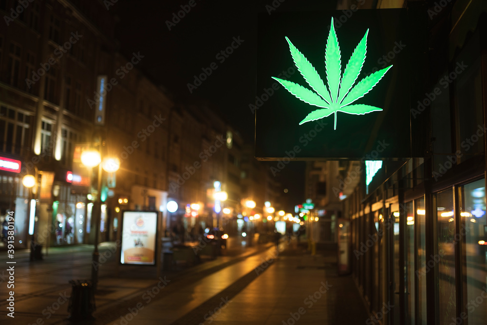 Neon cannabis leaf at the night street