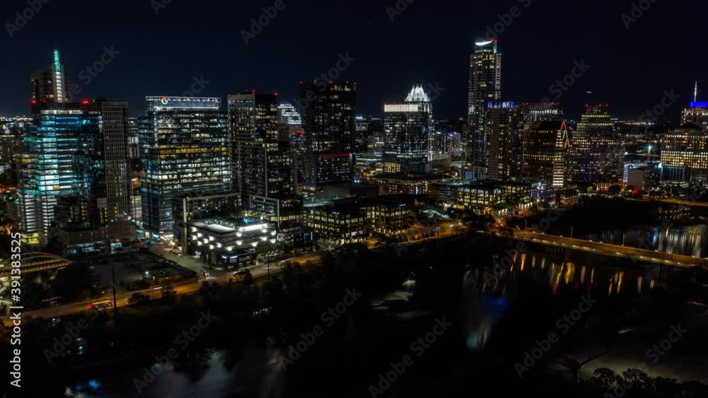 Low fly over lady bird lake with view of cityscape buildings in downtown Austin, Texas. Low fly over lady bird lake with view of cityscape buildings in downtown Austin, Texas.