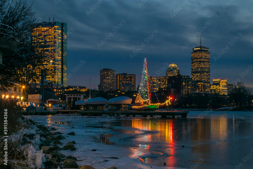 Fototapeta premium A sailboat decorated with Christmas Lights in celebration of the holidays 