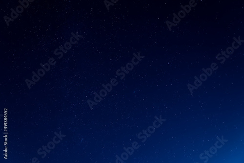 Night sky background with many shining stars, endless space concept.