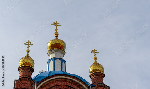 Three golden domes with crosses of Orthodox Church photo