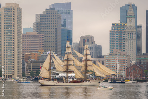 A tall ship sails into Boston Harbor