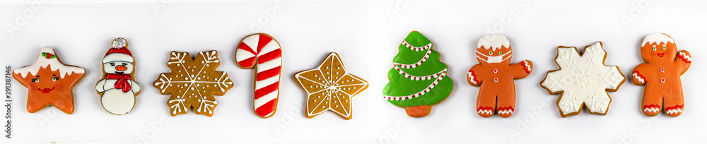 Christmas gingerbread. Delicious homemade gingerbread. Christmas homemade gingerbread. Gingerbread cookies on white on an isolated background. Banner. Screensaver