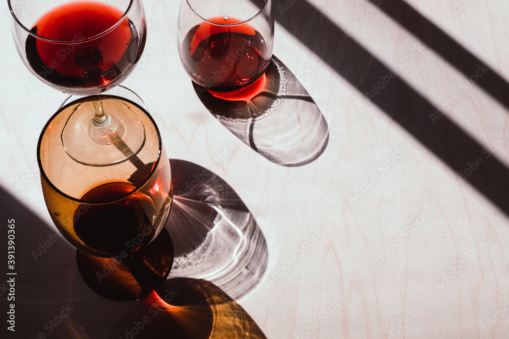 Фотография Red wine casting long afternoon shadows