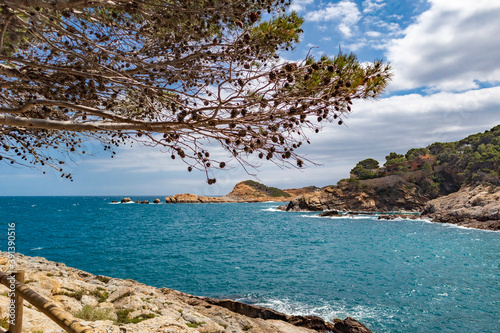 The seaside path and the beach of Sa Tuna in the village of Begur on t photo