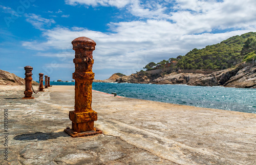 The seaside path and the beach of Sa Tuna in the village of Begur on t photo