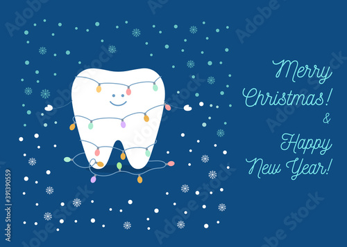 Tooth in Christmas light bulbs string. Merry Christmas and Happy New Year.  Greeting card from a dentistry.