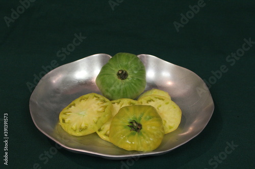 green tomatoes on a plate