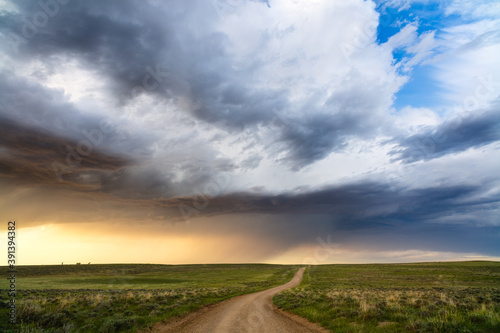 Canvas Print Scenic Wyoming landscape with rolling hills and dirt road in Thunder Basin Natio