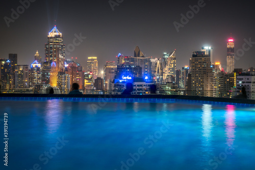 Obraz na płótnie Cityscape of Bangkok with Skyscrapers as Seen from Roof Top with Swimming Pool w salonie
