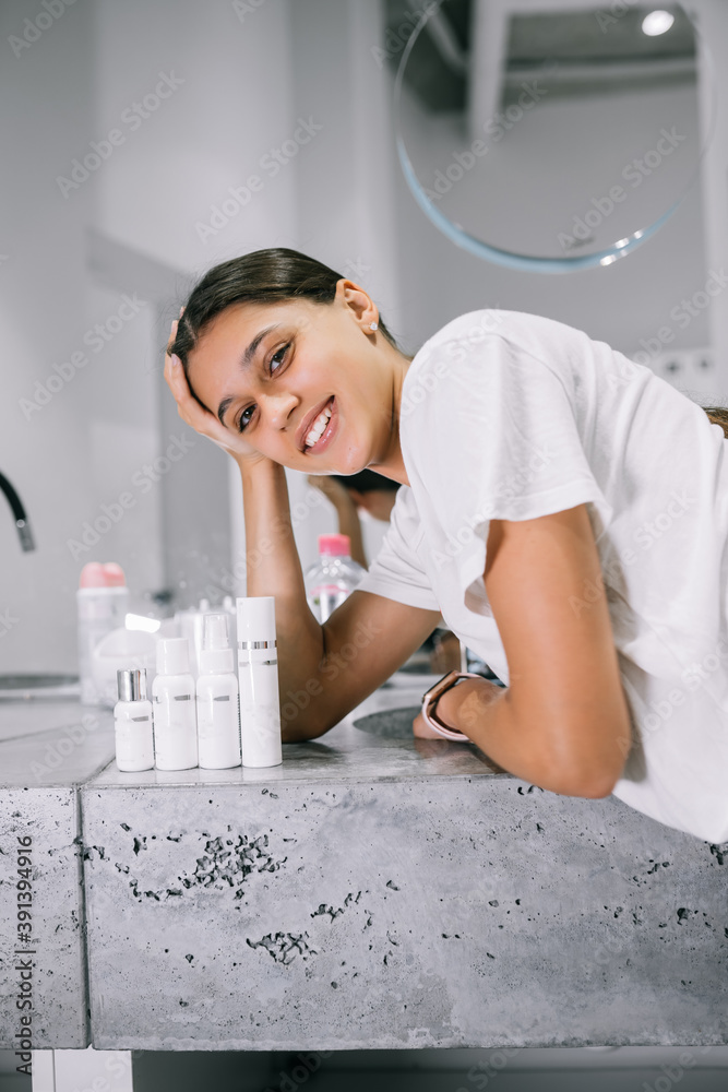painting of a woman with cosmetic bottles in the bathroom painting of a woman with cosmetic bottles in the bathroom