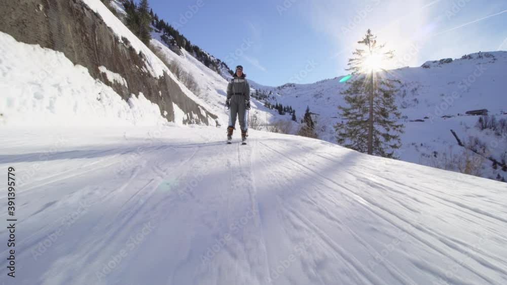 Amateur skier skiing on slopes in the French alps. Beginner girl on skies. Amateur skier skiing on slopes in the French alps. Beginner girl on skies.