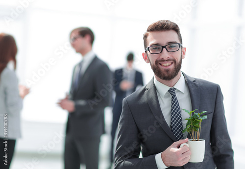 Photography businessman with green young escape on blurred background