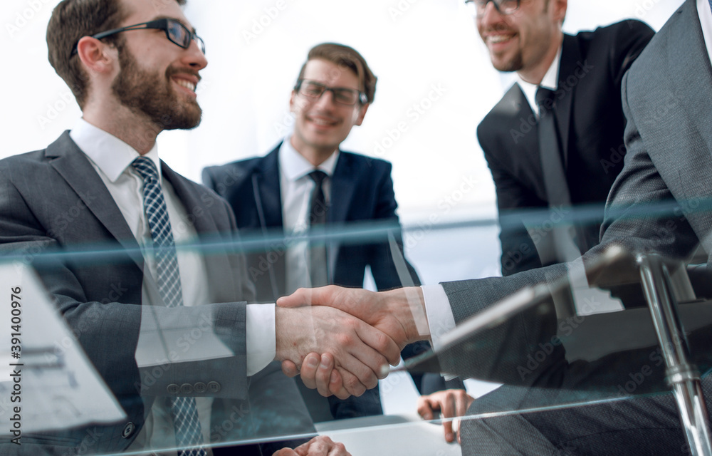 bottom view.a handshake is serious business partners bottom view.a handshake is serious business partners