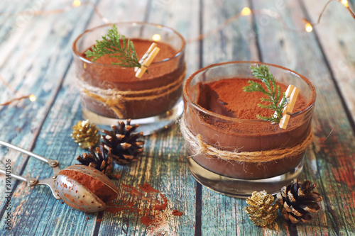 Two portions of chocolate mousse, cocoa powder dressing for New Year's holiday photo